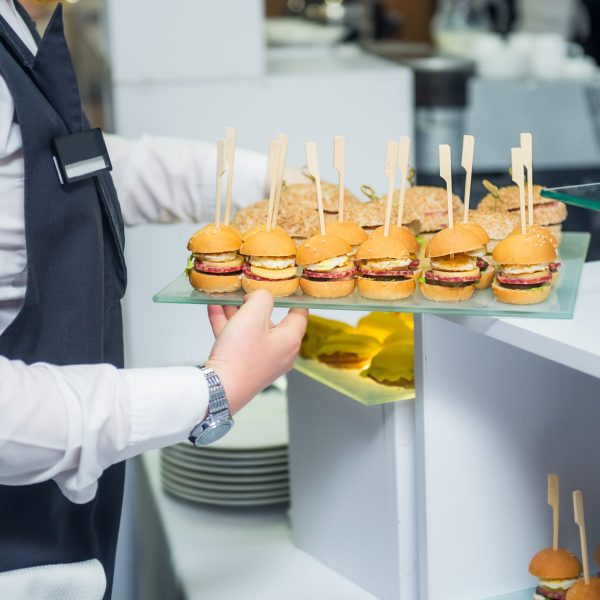 the-waiter-is-serving-a-catering-buffet-table-with-2023-11-27-05-36-39-utc the-waiter-is-serving-a-catering-buffet-table-with-2023-11-27-05-36-39-utc